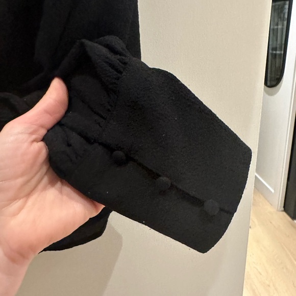 Size M. Black long sleeved blouse with cute detail on shoulders and cuff. - Picture 2 of 5